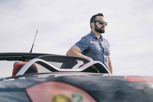 attractive-man-posing-in-convertible-car-Porsche 928