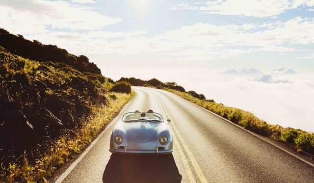 coupe-driving-on-country-road-in-vintage-sports-car-Porsche 928